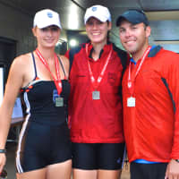 <p>Saugatuck Rowing Club&#x27;s Women&#x27;s 2x team, Jo Gurman of Weston and Christina Johnson of Redding, stand with coach Chase Graham after winning a silver medal at nationals.</p>