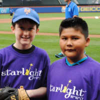 <p>Starlight supporter Ryan Heinzerling, 11, of Greenwich (left) and Ernesto Martinez, 9, of Yonkers eagerly await the signal to walk onto Citi Field to throw the ceremonial first pitch at last Tuesdays Mets vs. Cardinals game.</p>