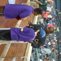 <p>Nine-year-old Ernesto Martinez (left) from Yonkers and 11-year-old Ryan Heinzerling (right) from Greenwich, Conn. receive last minute instructions about throwing out the ceremonial first pitch before the New York Mets</p>
