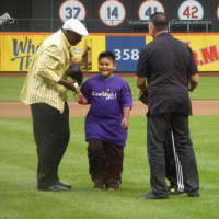 <p>Former New York Mets Mookie Wilson (left) and John Franco (right) congratulate 9-year-old Ernesto Martinez of Yonkers for throwing the first pitch at the Mets game during the 11th Annual Starlight Night at Citi Field.</p>