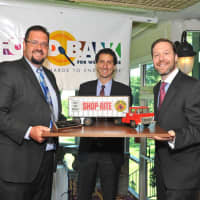 <p>Chris Mazzarella (left), Bob Scher (right) and Tom Urtz of ShopRite accepted the Corporate Service Award.</p>
