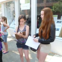 <p>Maryann Kenehan, left, and her daughters Cailin and Mary Kate filled out forms for the open casting call in Hastings.</p>