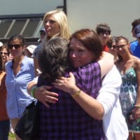 <p>Dylan Hockley&#x27;s mother, Nicole, gets a hug from a supporter.</p>