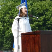 <p>Wilton High School Class of 2013 Valedictorian Paige Wallace addresses her classmates during Saturday&#x27;s graduation ceremony.</p>