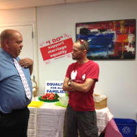 <p>Rich Houston of Mount Vernon (left) and Tony Carlyle of White Plains (right) discuss the Supreme Court decisions on marriage equality at the LOFT LGBT Center&#x27;s reaction celebration.</p>