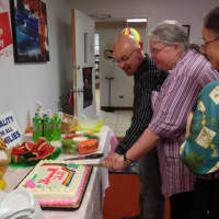 <p>David Juhren joins Karen Carr and her wife Yvette Christofilis (Irvington) in cutting a rainbow cake to celebrate the Supreme Court decisions on DOMA and Prop 8. </p>