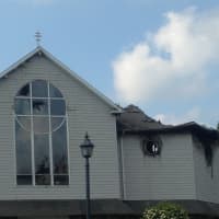 <p>The stained-glass windows are smashed and the roof is collapsed at St. Nicholas Church in Danbury after Saturday&#x27;s fire. </p>