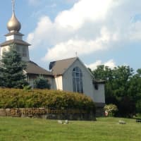 <p>St. Nicholas Church, a landmark on Pembroke Road in Danbury, is heavily damaged after a fire Saturday. The roof behind the onion dome has collapsed. </p>