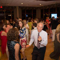 <p>Friends of Karen supporter Vinny Liscio, of Somers, and friends dance during the benefit gala on June 14 in Mamaroneck.</p>
