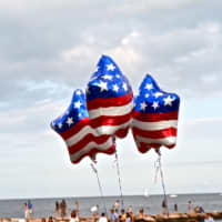 <p>The stars are out early as red, white and blue balloons dance in the sky before the Westport fireworks. </p>