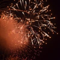 <p>The sky is bright as fireworks explode near Westport&#x27;s Compo Beach. </p>