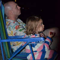 <p>These two share a chair to enjoy the fireworks show in Westport on the eve of the Fourth of July. </p>