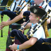 <p>One of the young bag pipers at the 90th annual Scottish Round Hill Highland Games at Cranbury Park in Norwalk.</p>