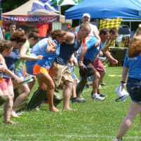 <p>A three-legged sack race Saturday at the Round Hill Highland Games at Cranbury Park in Norwalk. </p>