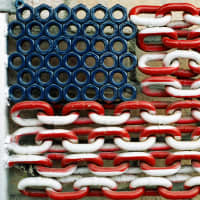<p>A photograph of a painted chain link fence by Robert Carley. His exhibit, Flags Across America, is up at the Bruce Museum in Greenwich, Conn.</p>