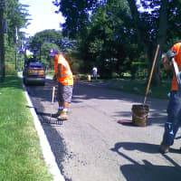 <p>Town of Greenburgh workers repair potholes.</p>
