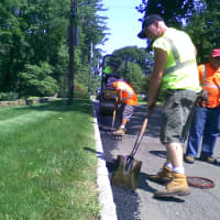 <p>Toen workers filling potholes on Greenburgh streets.</p>