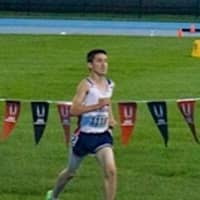 <p>Eric van der Els, a rising sophomore at Brien McMahon, strides toward the finish line and victory in the 1,500 meters at the Junior Olympic regional championships.</p>