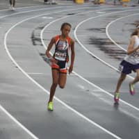 <p>Angela Saidman (left) of the Wilton Running Club competes at the Junior Olympics.</p>
