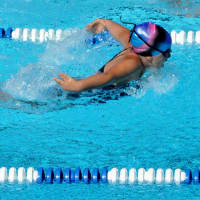 <p>Ossining&#x27;s Ivonne Gomez raced a 25-yard butterfly, taking third place.</p>