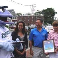 <p>Fairfield residents Anne and Jack, 12, Arnold are at the Dairy Queen on the Post Road to fundraise and give out plaques to Dairy Queen owner Nick Frattaroli and the Bridgeport Bluefish for their help in fundraising for the Maria Fareri hospital.</p>