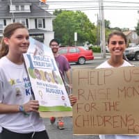 <p>Fairfield Dairy Queen employees help to raise money for the Maria Fareri Children&#x27;s Hospital by making signs to hold in the street.</p>