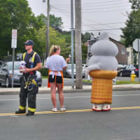 <p>Employees of the Fairfield Dairy Queen are joined in the street by members of the Fairfield Fire Department to help raise money.</p>