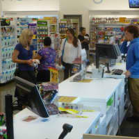 <p>Customers on line to make purchases at the new Walgreens.</p>