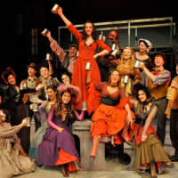 <p>The Oliver cast sings during the show.</p>