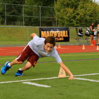 <p>Sam White works on an agility drill.</p>