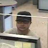 <p>The suspect in the Thursday bank robbery, above, has been linked to a bank robbery last week in Greenwich. </p>