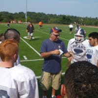 <p>Briarcliff football coach John Consorti, center, will have the help of a dozen Alexander High School players as the two schools combine for the 2013 season.</p>