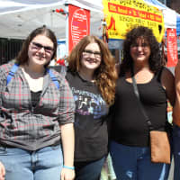 <p>Executive director of the Tarrytown - Sleepy Hollow chamber of commerce, John Sardy, showed three women from Schenectady around the fair. </p>