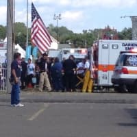 <p>An injured child is loaded into an ambulance Sunday at the Norwalk Oyster Festival. </p>