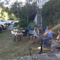 <p>Musicians play for the audience at the second anniversary celebration for Hello Yoga in Wilton.</p>