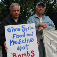 <p>Signs carried by protesters in Hastings offer alternatives to military action in Syria.</p>