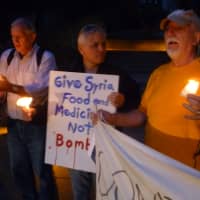 <p>Anti-war protesters make a plea Monday in Hastings for Congress to reject military intervention in Syria.</p>