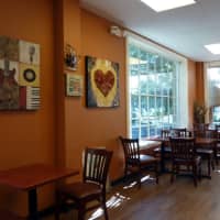 <p>The seating area at Coffee Story in Wilton is warm and inviting.</p>
