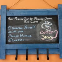 <p>A chalkboard coat rack with the saying &quot;Real friends don&#x27;t let friends drink bad coffee&quot; decorates a wall at Coffee Story in Wilton.</p>