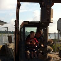 <p>Travis Rekos, the brother of Sandy Hook victim Jessica, and Fairfield fire fighter Patrick Barry start digging the new playground at Fairfield&#x27;s Penfield Beach Friday morning. </p>