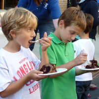<p>Children enjoy cake Wednesday during the Westport Weston Y&#x27;s 90th birthday celebration. </p>