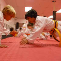 <p>Flexibility exercises are a key to a good workout at the dojo.</p>