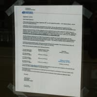 <p>The notice placed on the doors of the former downtown post office building in Stamford to alert people of the closing.</p>