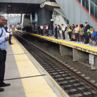 <p>Metro-North commuters line the Stamford train platform</p>