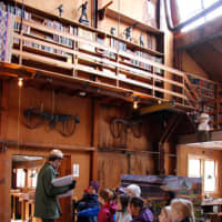 <p>Students get a close up look at the newly restored historic Young Studio at Weir Farm National Historic Park. </p>