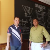 <p>Fairfield restauranteur Patrick Jean and his Head Chef Winnie Togonon in front of the chalkboard and a photo of Jean&#x27;s children, Tristan and Chloe, who the restaurant is named after. </p>