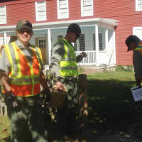 <p>A group of National Park Service workers close off a walkway near the main Weir house Tuesday. </p>