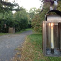 <p>A long lantern path entrance is provided at Philipsburg Manor.</p>