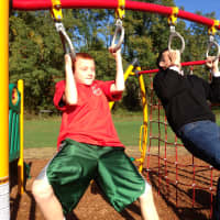 <p>Senator Ball challenged a fifth grade student to a pull-up contest on the new equipment. </p>