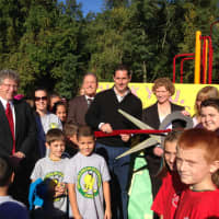 <p>Senator Ball and Principal Patricia Mcilvenny-Moore cut the ribbon of the playground together.</p>